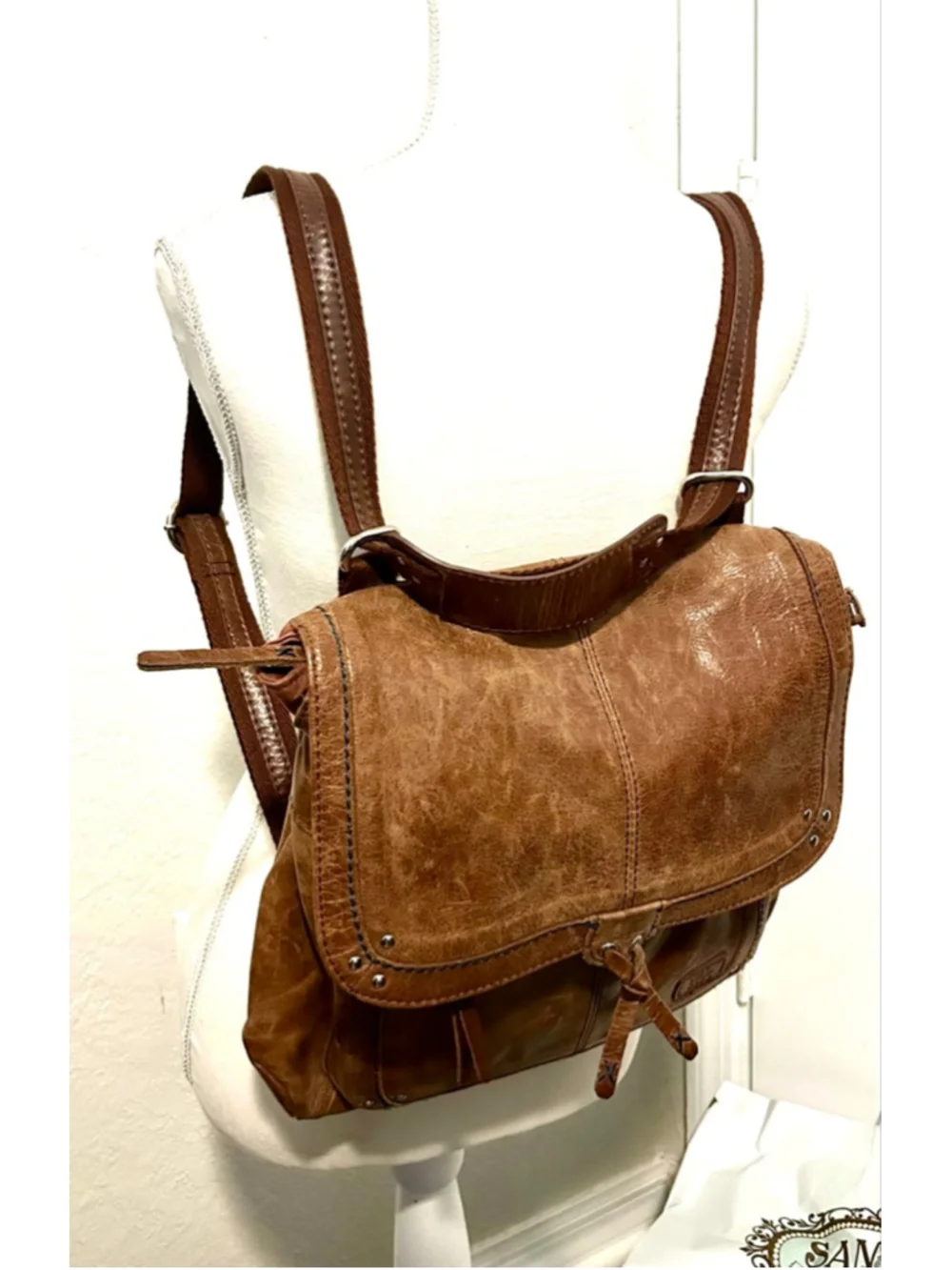 The Sak Ventura Leather Convertible Backpack in a brown, distressed leather